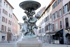 Chambery Airport in French Alps with snow-capped Savoie mountains, luxury ski transfer vehicles, traditional French alpine chalets, premium ski resort transportation service