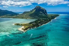 Mauritius tropical paradise with turquoise lagoons, white sand beaches, luxury resorts, Le Morne Brabant mountain, palm trees, coral reefs, catamaran sailing