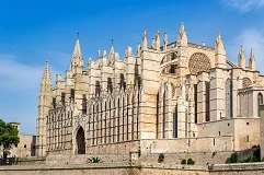 Palma de Mallorca Airport with Mediterranean beaches, Gothic cathedral, luxury yachts, mountain landscapes, premium transfer vehicles, Balearic island paradise backdrop