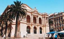 Toulon Airport with Mediterranean coastline, golden islands, luxury transfer vehicles, French Riviera beaches backdrop, premium airport transportation service